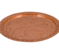 Carved copper disc.