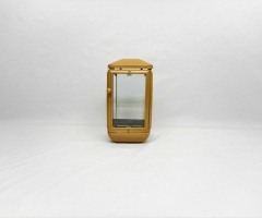 Four-sided aluminum cemetery candle.